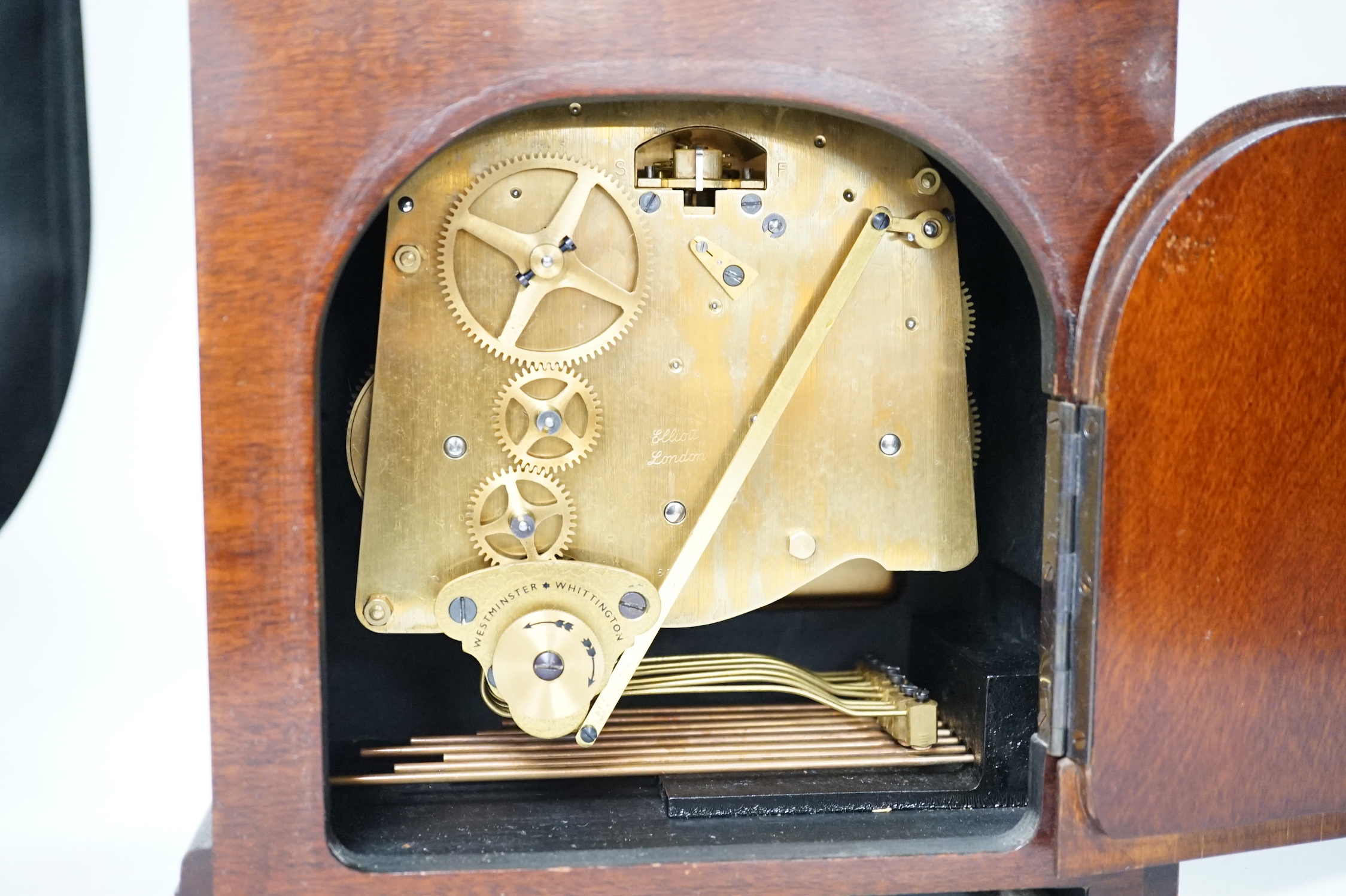 An Elliott walnut mantel clock, traditional dial and chiming movement, 25cm high